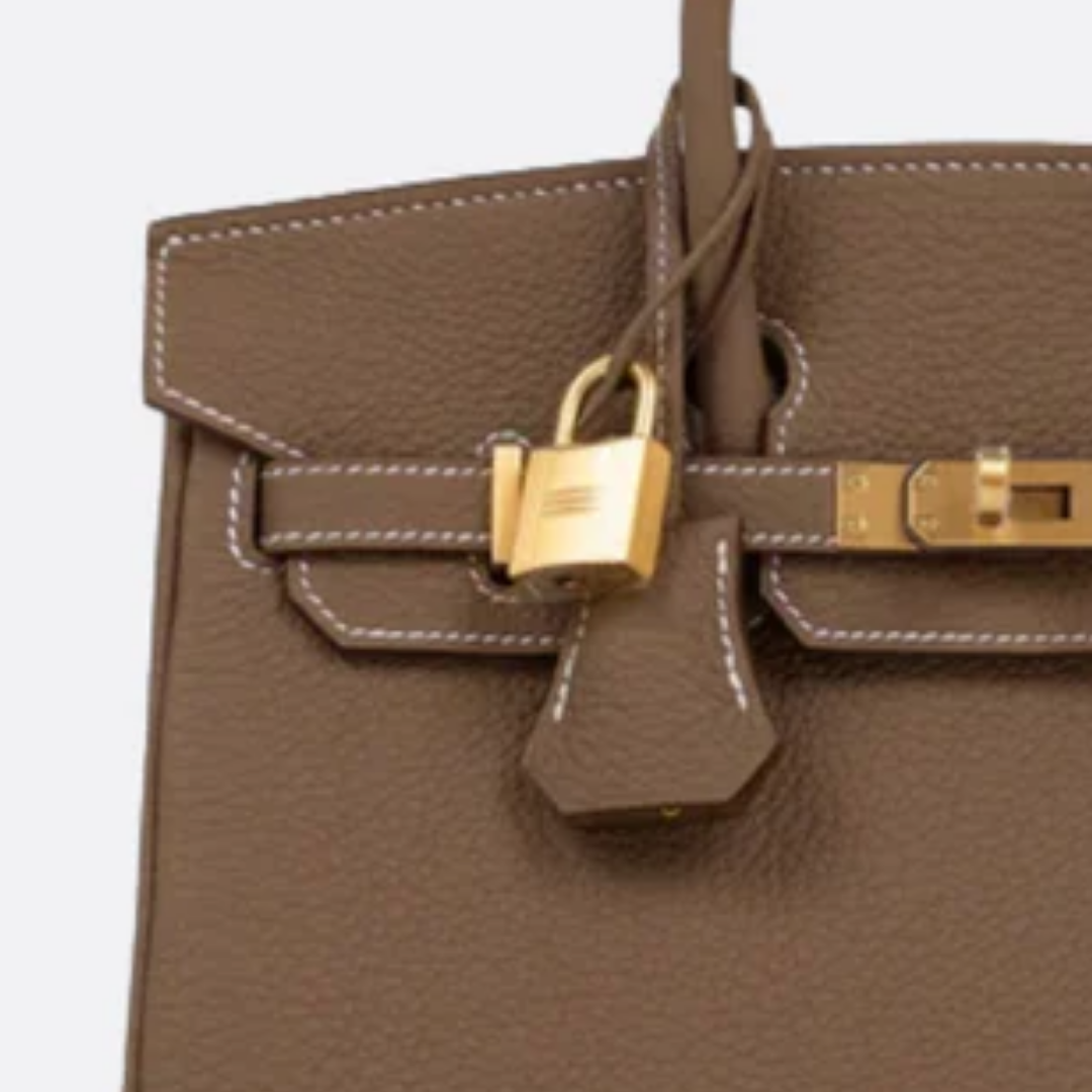 Tasche 25 Brk HSS Cr / GryTr aus Tg-Leder mit gebürsteten goldfarbenen Beschlägen